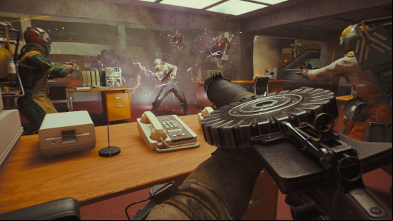 FBC Firebreak: A first-person view of someone aiming a drum-fed machine gun at a horde of zombies